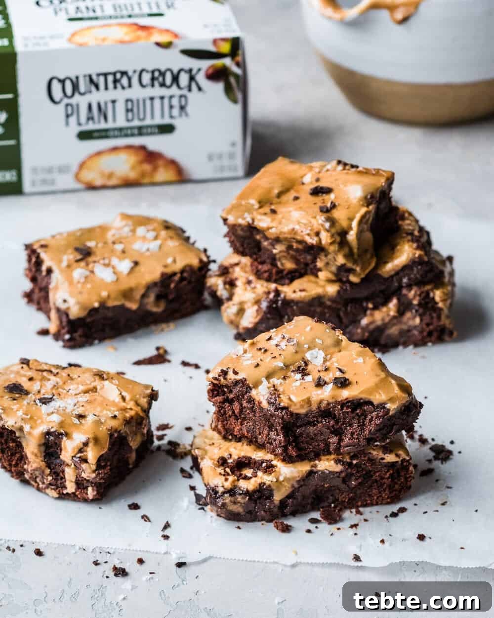 Vegan Gingerbread Brownies with Espresso Glaze Recipe 10 Brownies in stacks of twos on parchment paper.