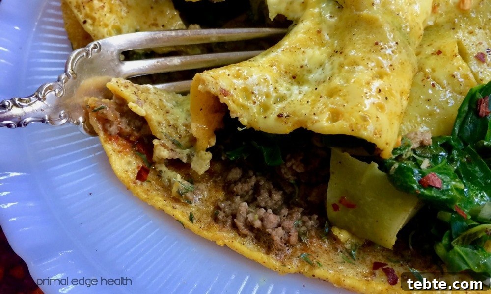 13 High-Protein Game Day Breakfasts to Fuel Your Morning 11 Low-carb stir fry omelette in a white plate.