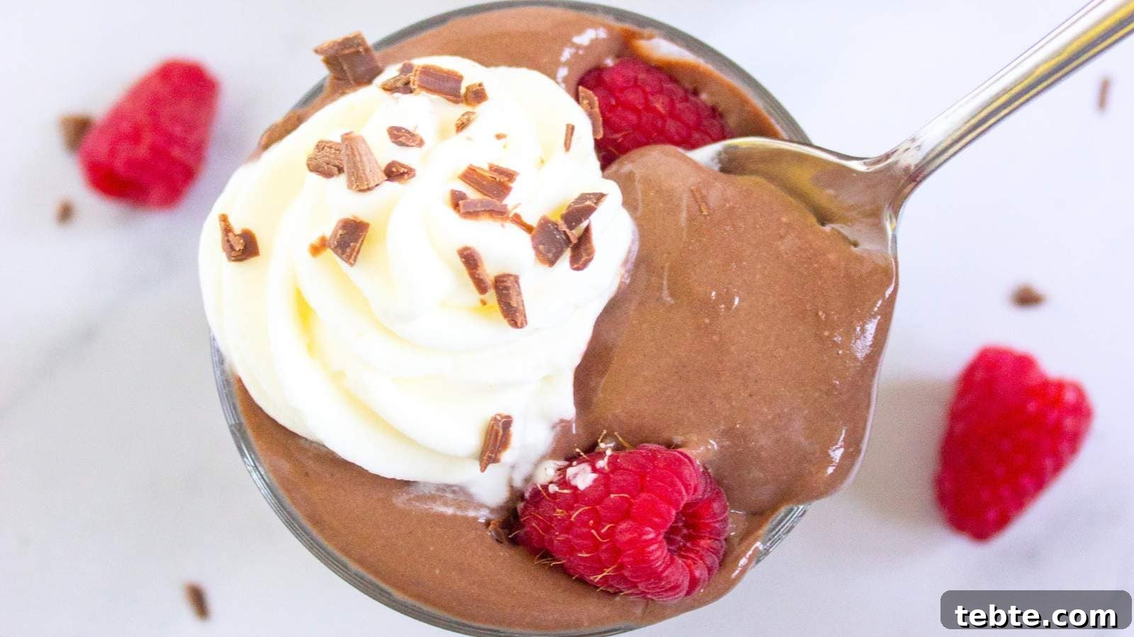 13 High-Protein Game Day Breakfasts to Fuel Your Morning 5 A glass cup filled with protein pudding topped with whipped cream.