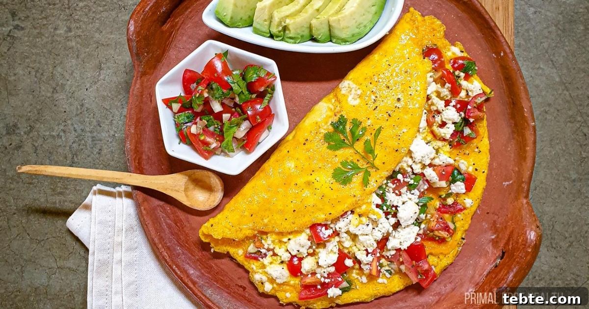 13 High-Protein Game Day Breakfasts to Fuel Your Morning 8 Mexican omelette folded with queso fresco and salsa on earthen serving tray.