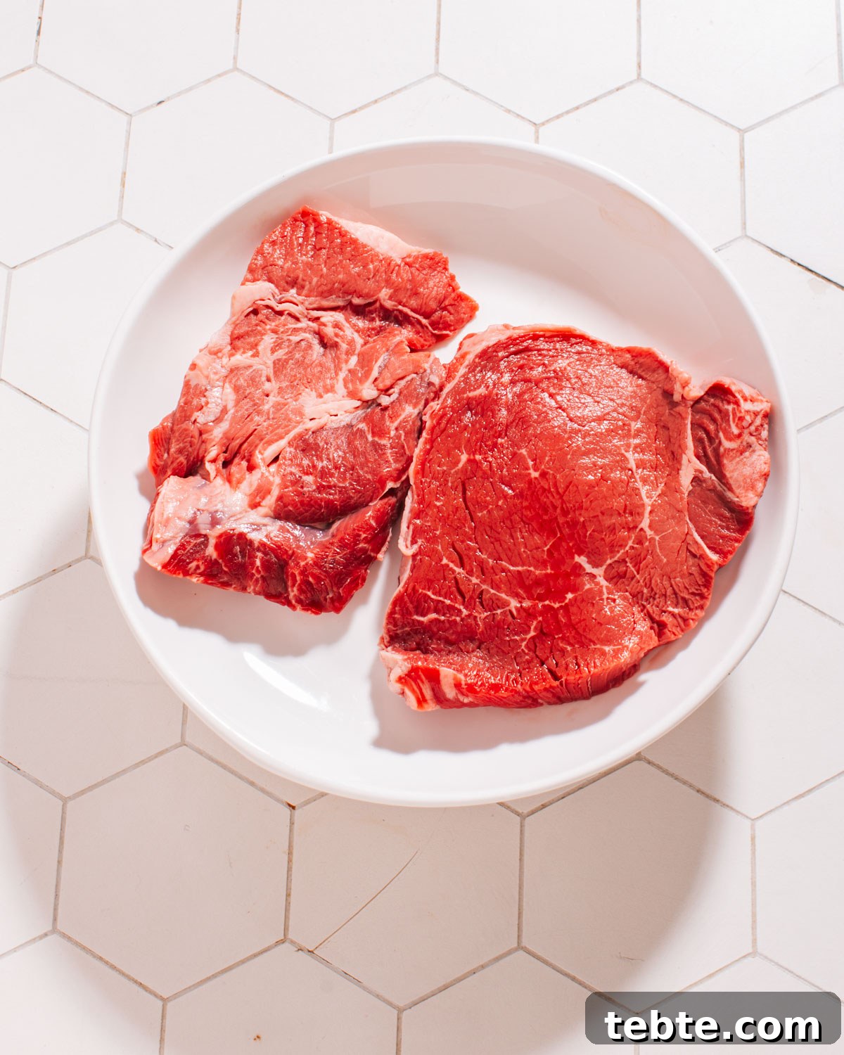 Grilled Flat Iron Steak with Creamy Peruvian Green Sauce 3 Steaks on a plate.