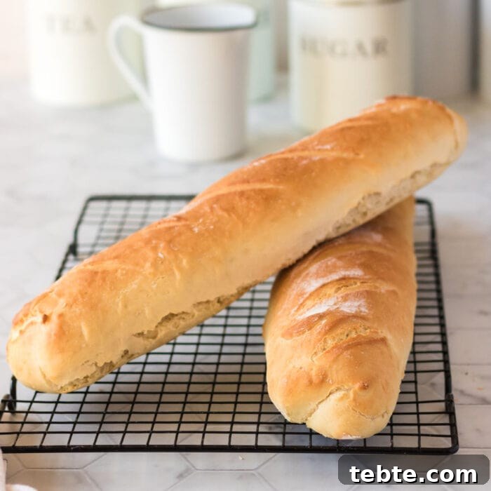 Savory Baked Cowboy Dip Recipe for Parties and Game Day 7 Homemade baguette stacked leaning on another.