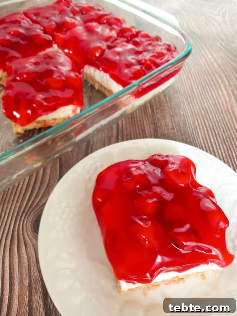 Classic Old-Fashioned Cherry Dessert Recipe 7 slice on plate and pan of cherry delight