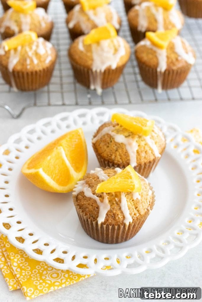 Citrus Poppy Seed Muffins with Orange Zest 11 plate of orange poppy seed muffins with rest of cooling rack behind