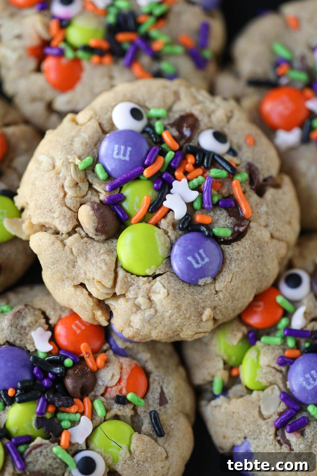 Soft Chewy Monster Cookies with Chocolate, Oats & Peanut Butter 4 monster cookies arranged on a plate.