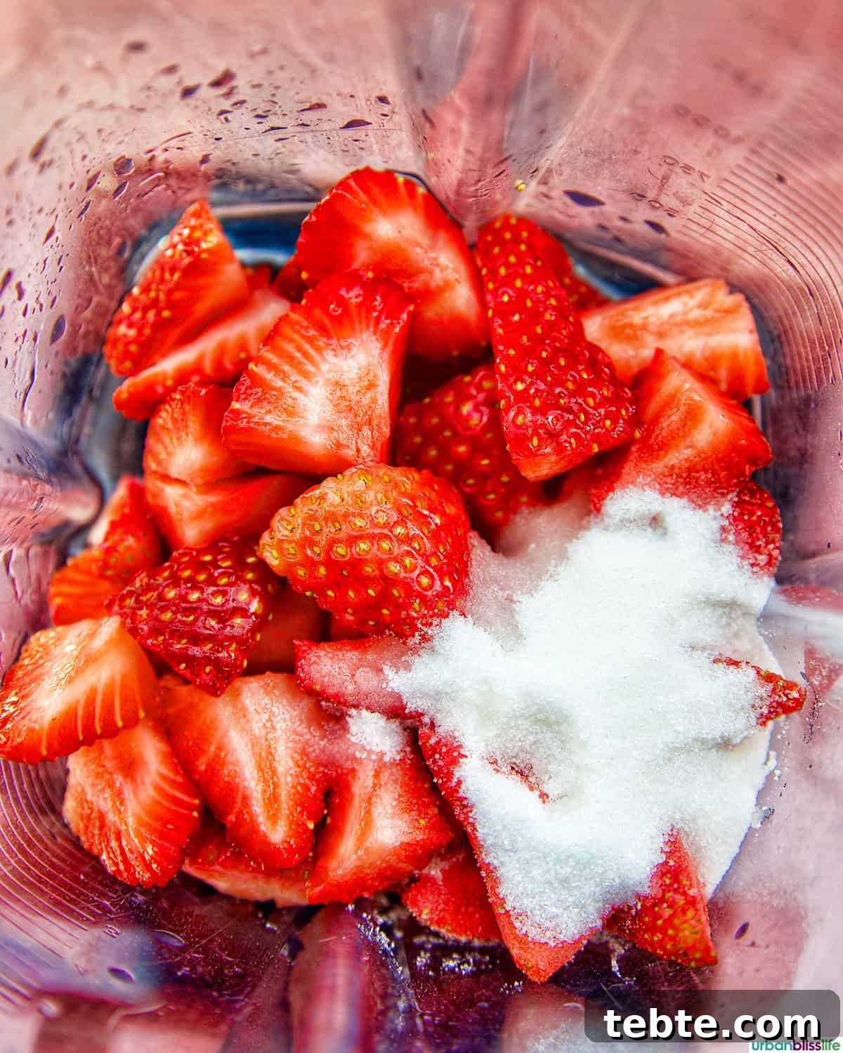 Homemade Strawberry Popsicles Recipe 6 strawberries and sugar in a blender.
