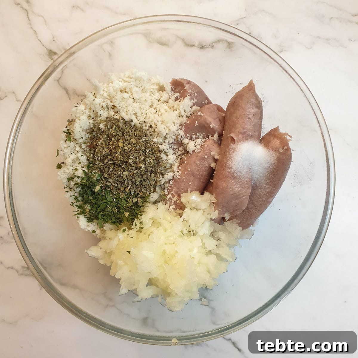 Sausage Stuffing with Sage and Onion 5 Ingredients for the stuffing in a bowl.