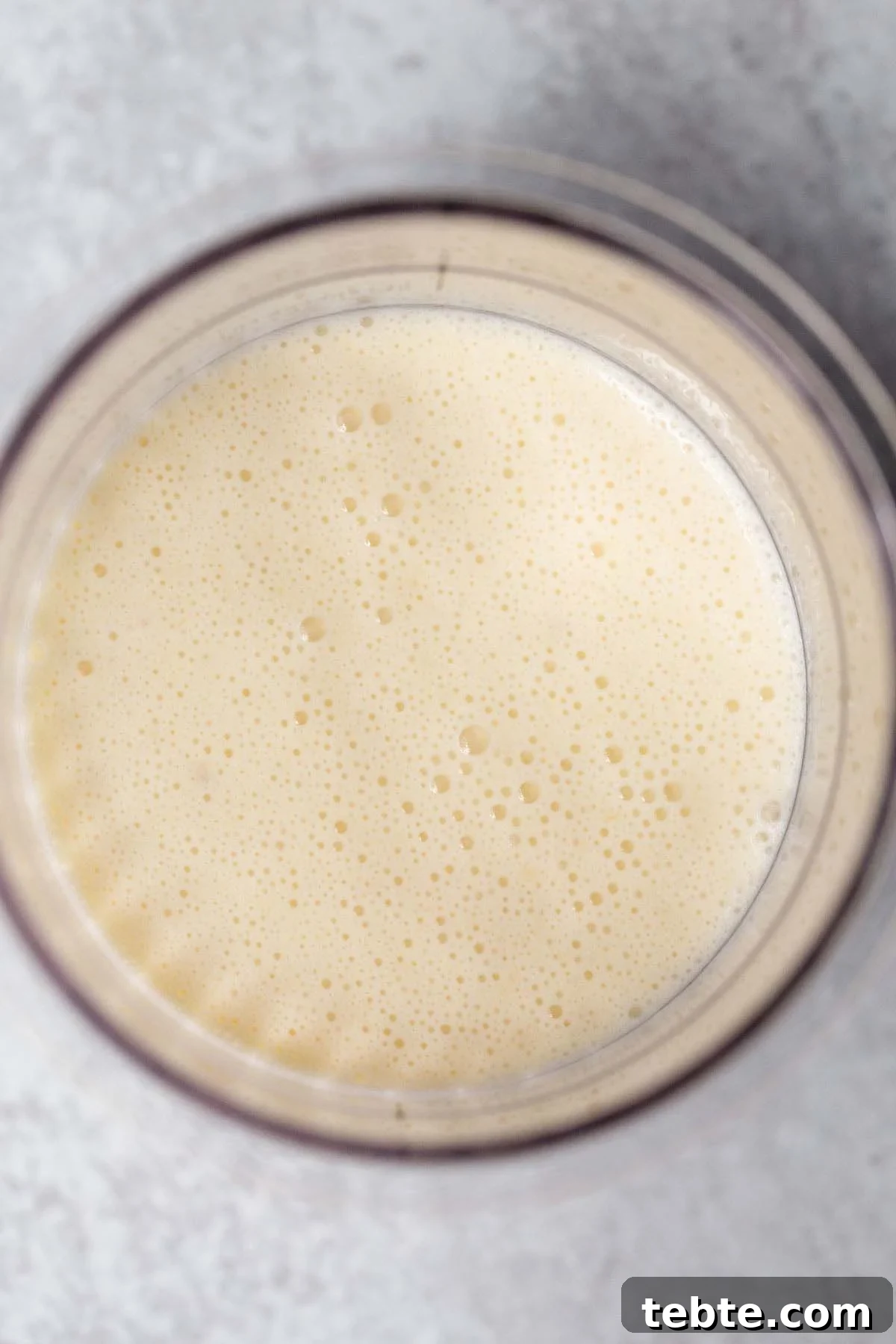 Banana Cream Pie Ice Cream Recipe for Ninja Creami 5 Banana ice cream mixture in Ninja Creami container