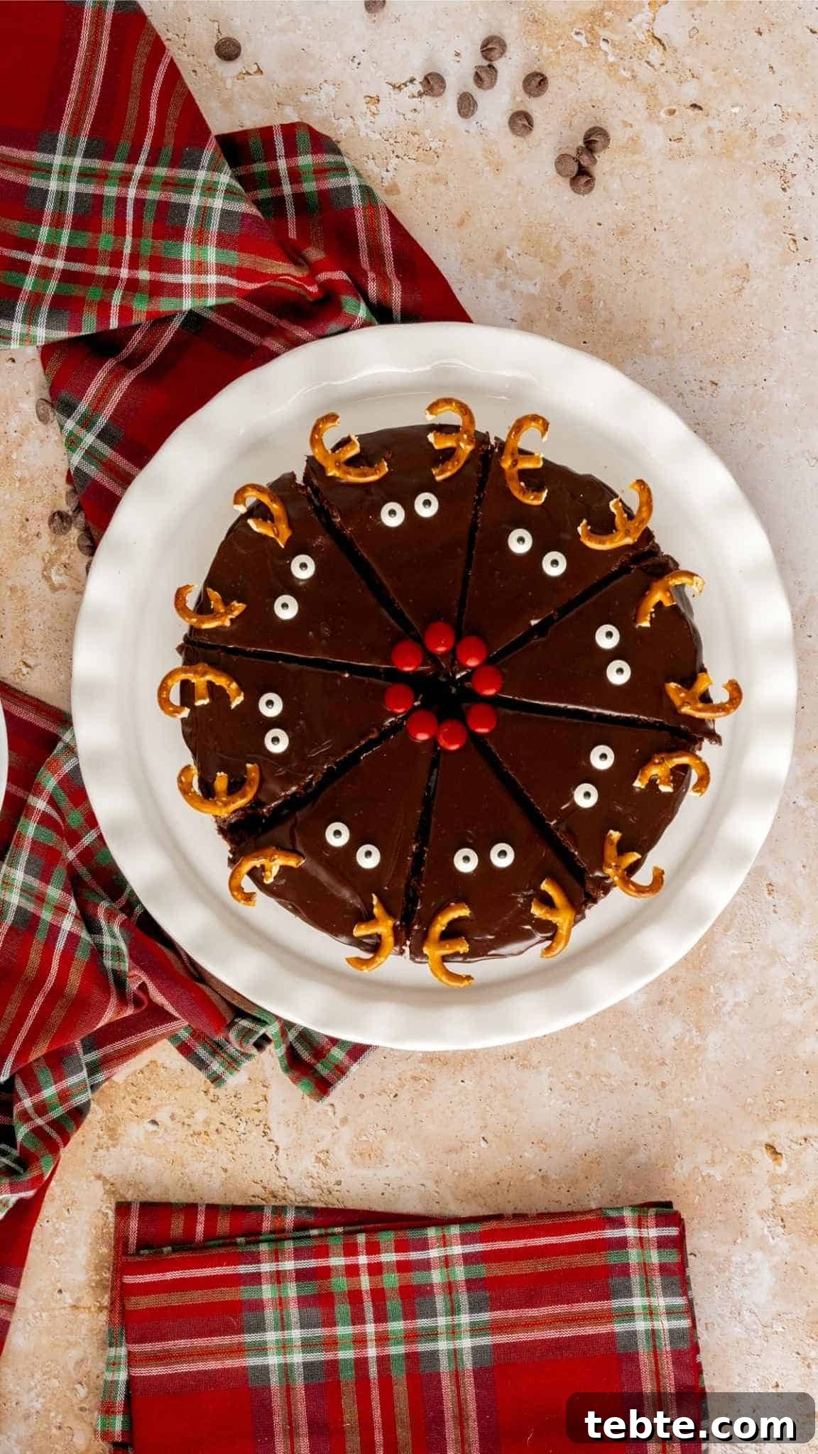 Reindeer Christmas Brownies Recipe for Festive Treats 4 Bird's eye view of triangle cut brownies decorated like reindeers with Christmas napkins in the background.