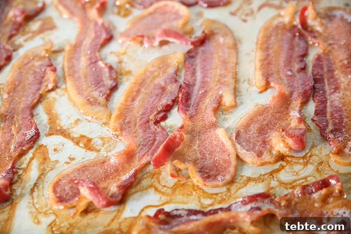 Fancy-Looking Christmas Eve Dinner Ideas for Busy Families 17 A cookie sheet full of oven-baked thick slices of bacon.