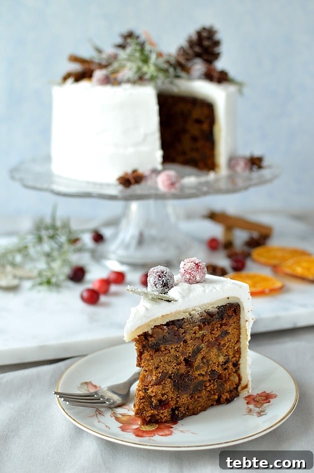 Ginger-Spiced Christmas Fruitcake with Rustic Decor 3 Gingered Christmas fruitcake with royal icing, pine cones, dried orange slices, spices and sugared cranberries, rosemary and bay leaves