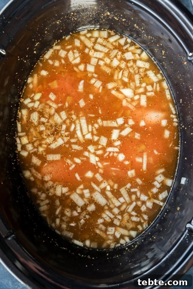 Creamy White Chicken Chili in the Slow Cooker 5 white chili in slow cooker before cooking