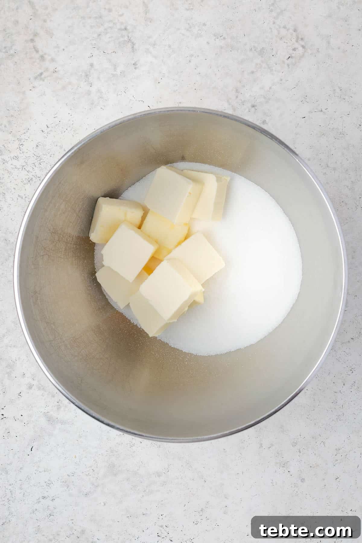 Classic Cranberry Orange Pound Cake Recipe 5 Butter and sugar in a large metal mixing bowl.