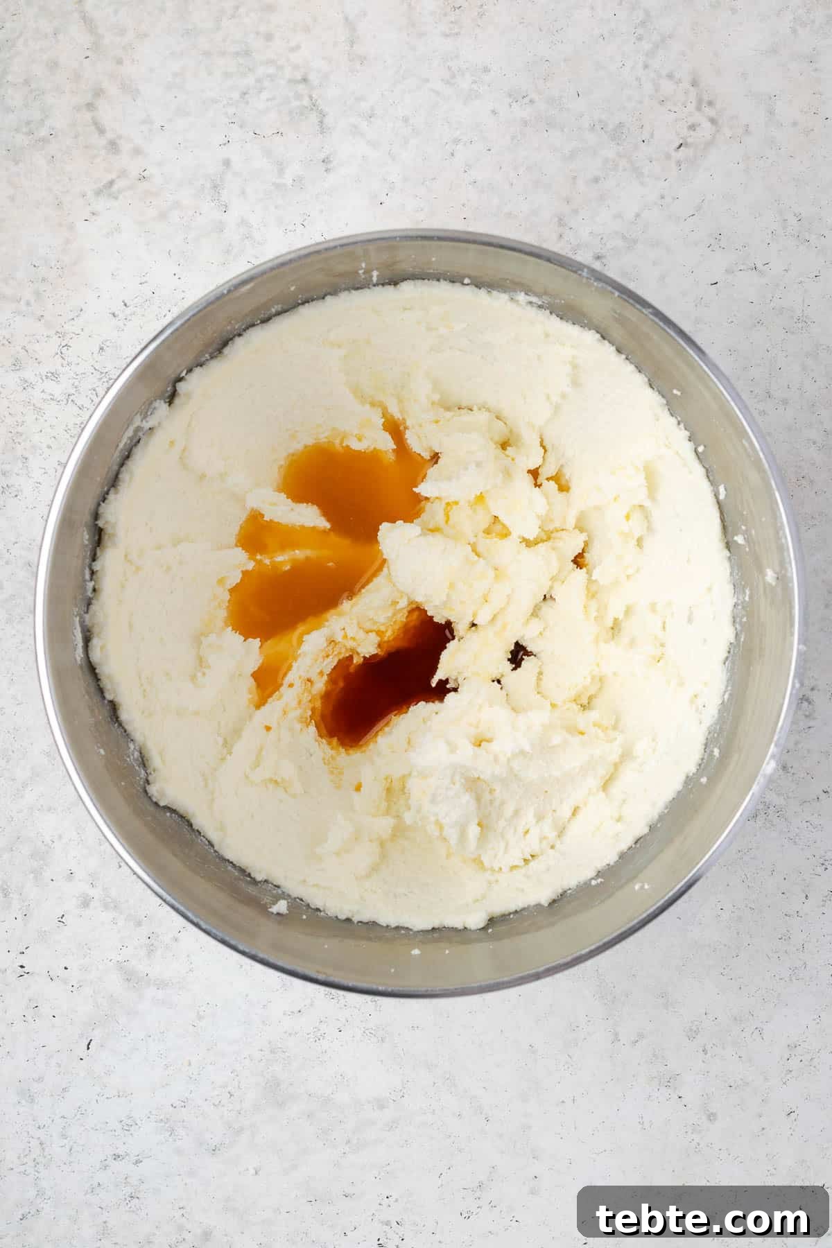 Classic Cranberry Orange Pound Cake Recipe 6 Orange juice and vanilla extract added to the beaten sugar and butter mixture.