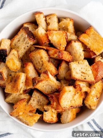 A bowl full of homemade croutons.