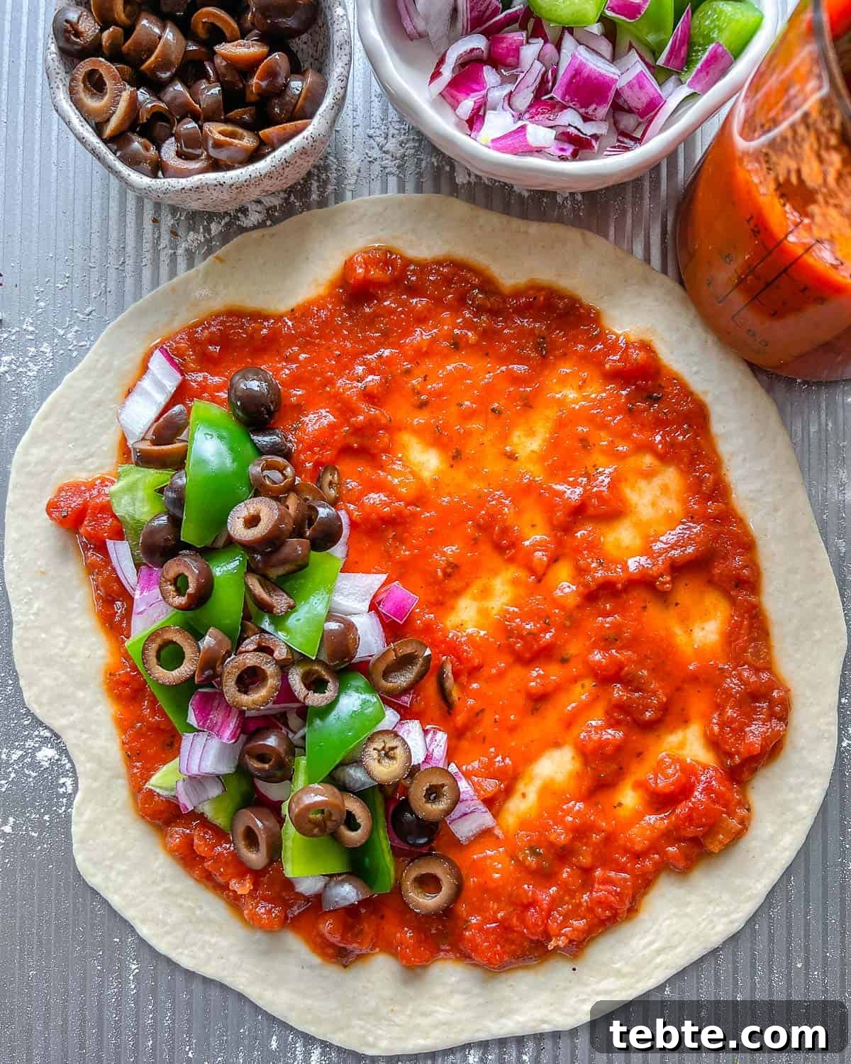 Vegan Calzones with Homemade Vegan Pizza Dough 11 process of filling Marinara Calzone with toppings