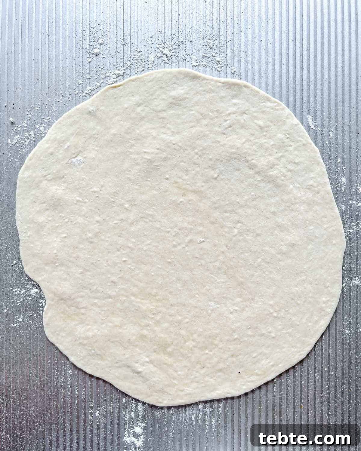 Vegan Calzones with Homemade Vegan Pizza Dough 9 rolled out dough against gray surface