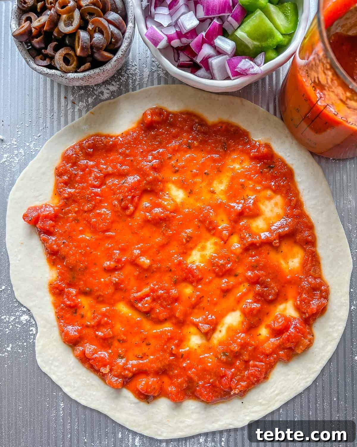 Vegan Calzones with Homemade Vegan Pizza Dough 10 process of adding marinara to Marinara Calzone