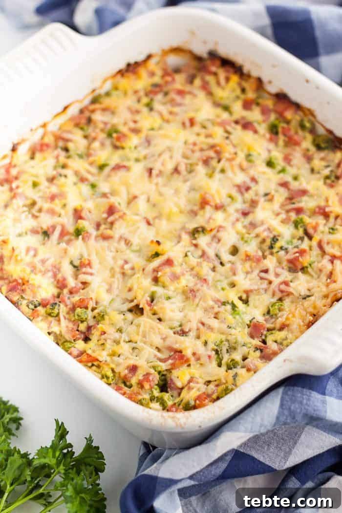 Keto Egg Roll in a Bowl: Low-Carb One-Pan Recipe 11 keto ham casserole in a white casserole dish next to a towel