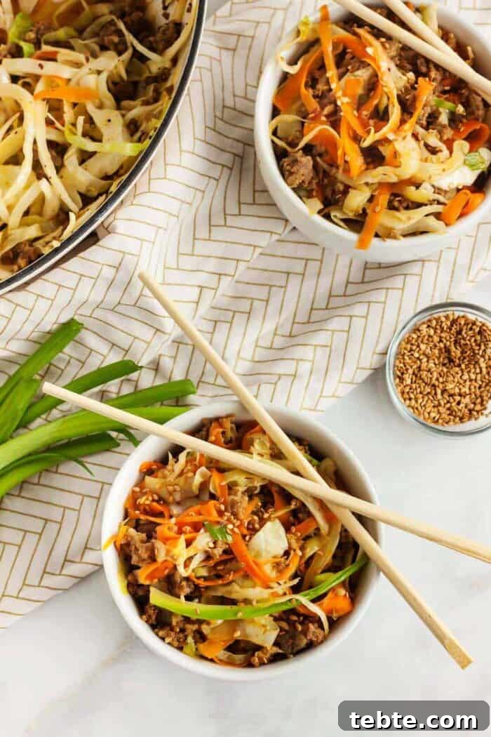 Keto Egg Roll in a Bowl: Low-Carb One-Pan Recipe 12 keto egg roll in a bowl served with chopsticks