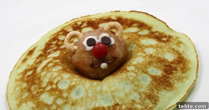 Groundhog-themed pancakes made with donut holes and small pancake rounds.