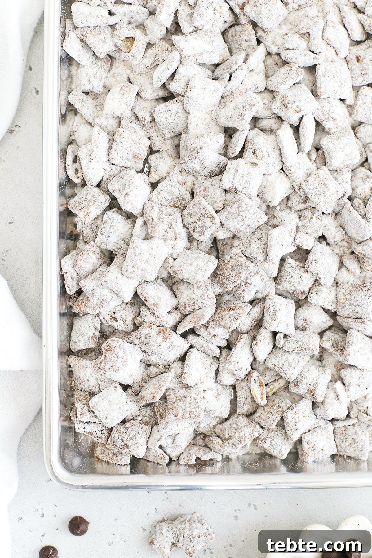 Gluten-Free Muddy Buddies Puppy Chow Recipe 5 gluten free muddy buddies on a sheet pan