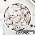 gluten free muddy buddies in a white bowl
